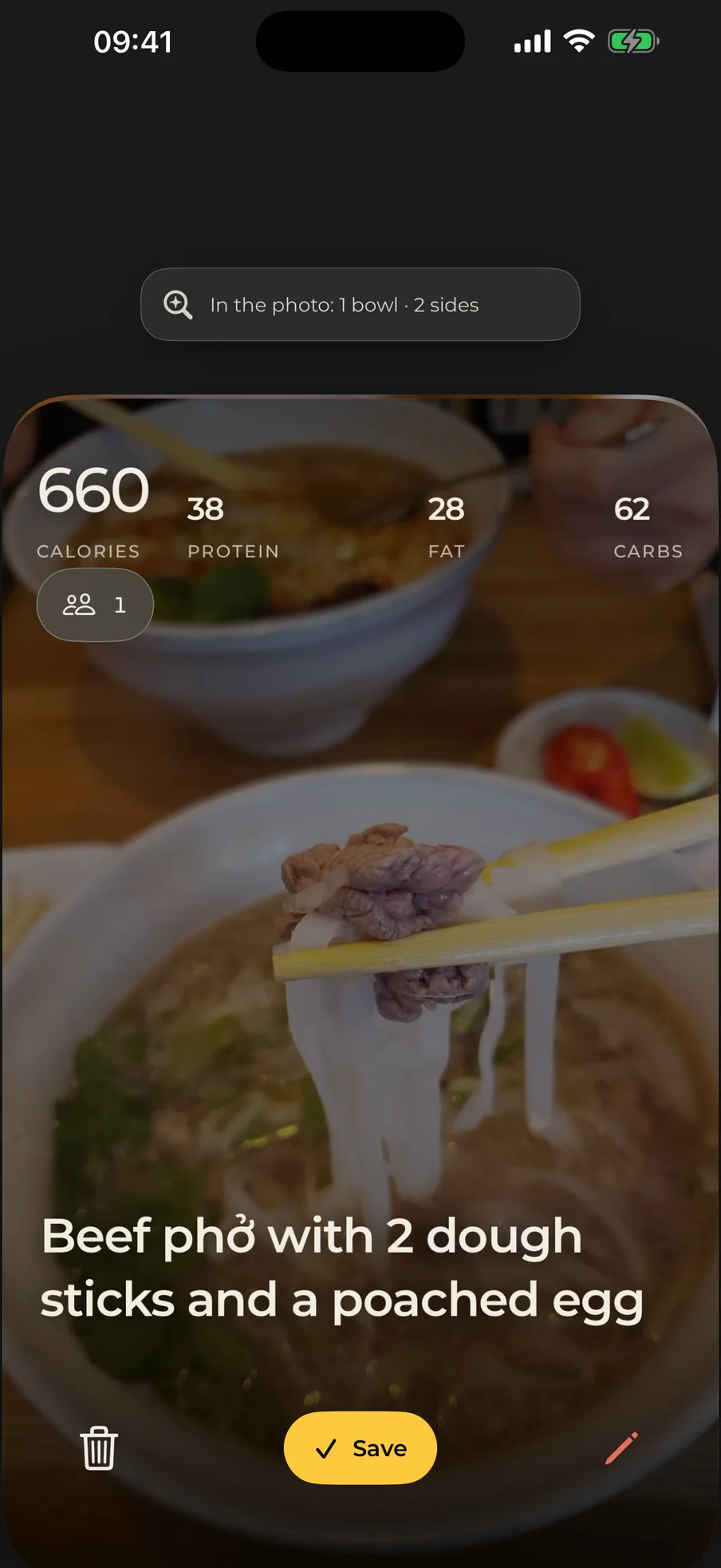 Lockeat review screen over a photo of beef phở: 660 calories, 38 protein, 28 fat, 62 carbs, and the dish named in plain words above a Save button.